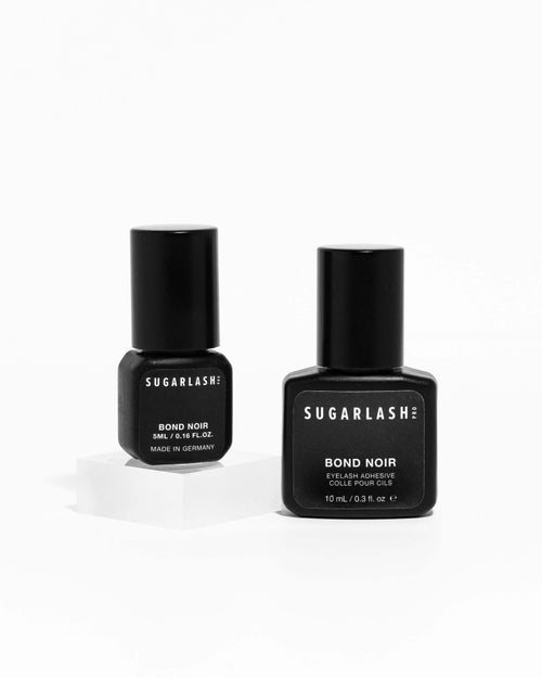 A 5mL and 10mL bottle of Bond Noir lash extension glue.