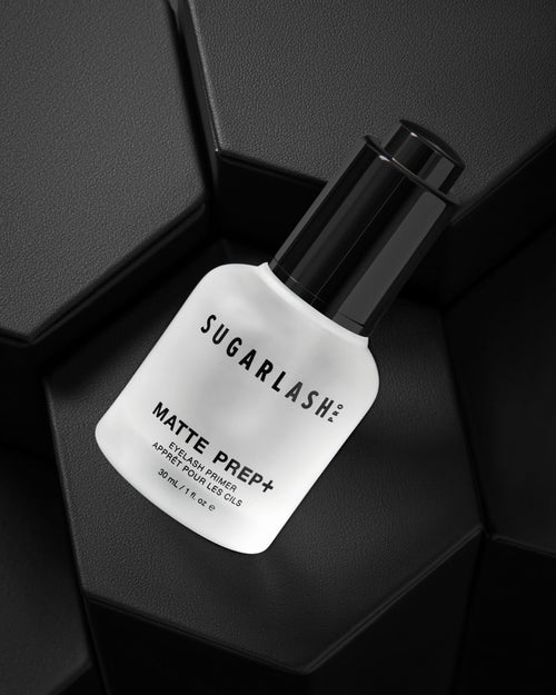 Bottle of Matte Prep+ mattifying eyelash extensions primer on geometric background.