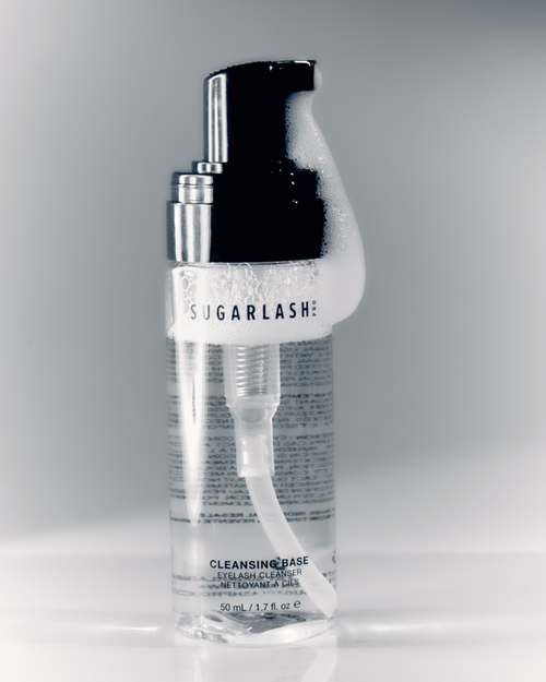 Lash extensions Cleansing Base with product coming out of pump.