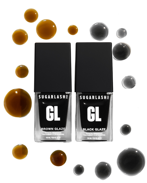 Brown and Black Glaze bottles with drops of Glaze around them to add nourish your brows and eyelash extensions
