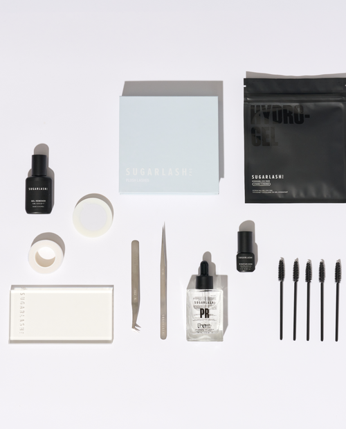 Mini eyelash extension kit of lash tweezers, wants, serum, gel remover, eye pads,