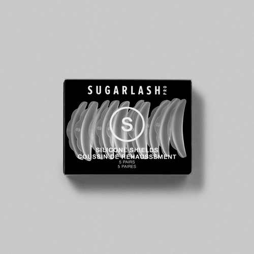 A box of S Professional Lash Lift Shields with shields being placed around the box.