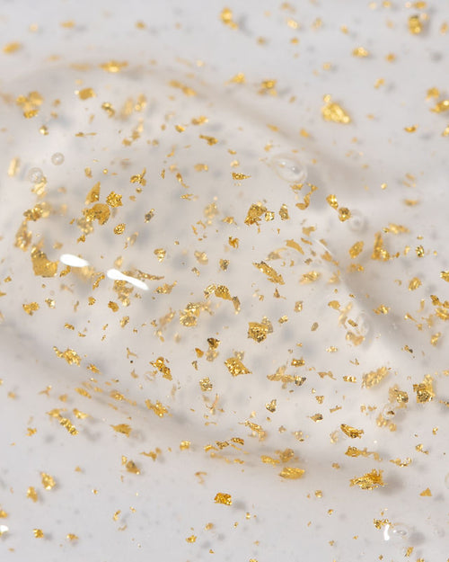 Close up of 24 karat gold Plump keratin treatment showing gold flake and gel texture after eyebrow lamination